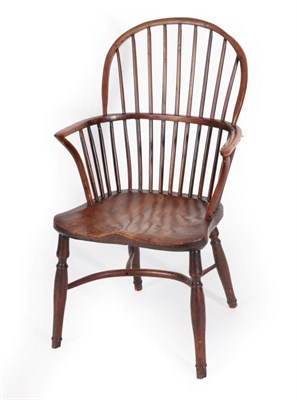 Lot 1348 - A Mid 19th Century Yew Windsor Armchair, the double spindle back support with curved arm...