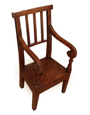 Lot 1352 - A Late 18th Century Child's Elm Stick-Back Armchair, with scrolled hand grips above spindle...