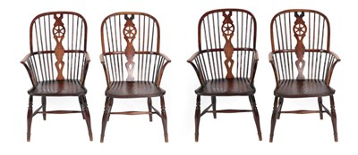 Lot 1353 - A Matched Set of Four Mid 19th Century Wheel Back Windsor Armchairs, comprising three ash...