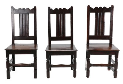 Lot 1355 - A Set of Three English Joined Oak Back Stools, circa 1700, each seat rail stamped EI, with wavy...