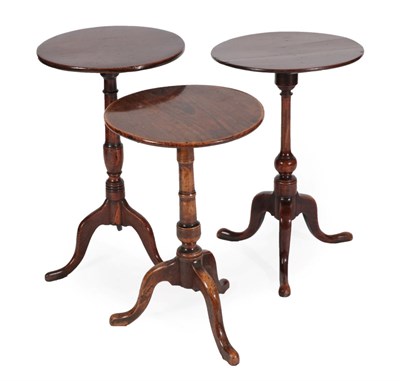 Lot 1367 - A George III Mahogany Tripod Table, late 18th century, the circular top on a knopped support...