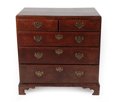 Lot 1380 - A Mid 18th Century Oak Straight Front Chest of Drawers, the moulded top above two short over...