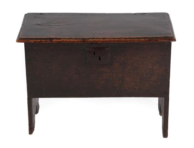 Lot 1388 - A Mid 17th Century Boarded Oak Chest, of six plank construction, the moulded hinged lid above...