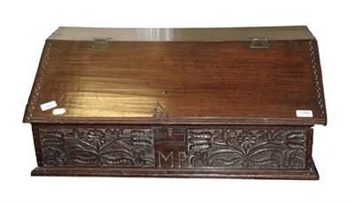 Lot 1390 - An Oak Bible Box, the hinged lid with chip carved border enclosing later drawers, the base...