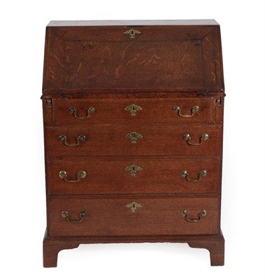 Lot 1391 - A Mid 18th Century Oak Bureau, of attractive proportions, the fall enclosing a fitted interior...