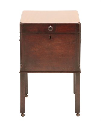 Lot 1428 - A George III Mahogany Cellaret, circa 1800, of square form with hinged lid and fluted canted...