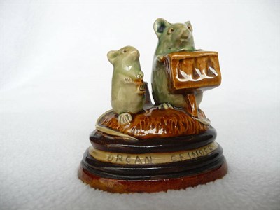 Lot 1426 - A Doulton Lambeth Stoneware "ORGAN GRINDER" Mouse Menu Holder, by George Tinworth, with a green...