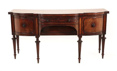 Lot 1429 - An Early 19th Century Mahogany and Ebony Inlaid Bowfront Sideboard, with central drawer above a...