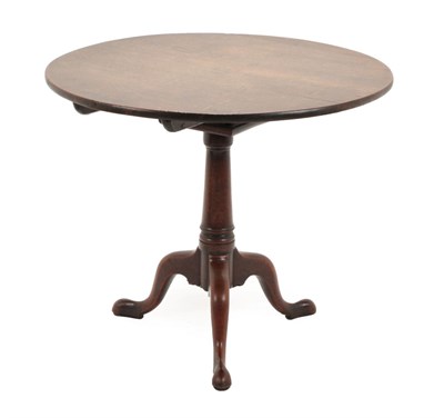 Lot 1439 - A George III Mahogany Bird Cage Tripod Table, late 18th century, the circular flip-top on a gun...