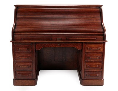 Lot 1455 - An Early 20th Century Oak Rolltop Desk, the S shaped shutter enclosing an arrangement of...