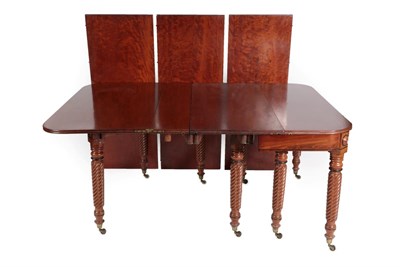 Lot 1468 - An Early 19th Century Mahogany Telescopic Extending Dining Table, with four original leaves,...