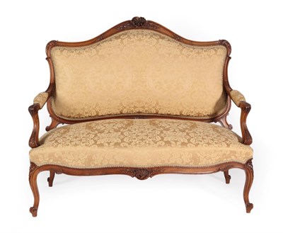 Lot 1496 - A Late 19th Century French Walnut Two-Seater Sofa, in Louis XVI style, recovered in gold floral...