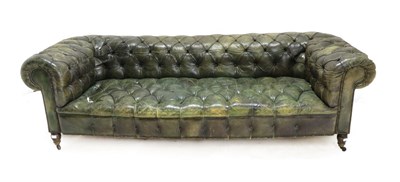 Lot 1499 - A Close-Nailed Buttoned Green Leather Chesterfield Sofa, early 20th century, with rounded arm...