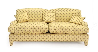 Lot 1500 - An Early 20th Century Howard Style Feather-Filled Three-Seater Sofa, recovered in yellow floral...