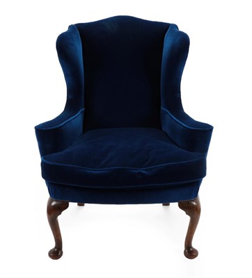 Lot 1513 - A George I Style Wing-Back Armchair, late 19th century, recovered in blue velvet, with outswept...