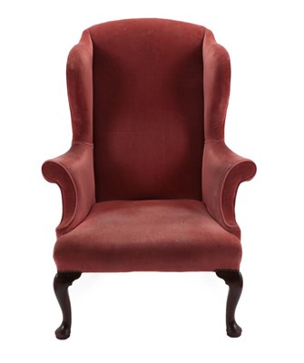 Lot 1514 - A 19th Century Wing-Back Chair, in George I style, recovered in pink velvet, with outswept arms...