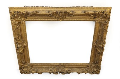 Lot 1522 - A Carved and Gilt Oak Picture Frame, in Louis XIV style, of rectangular form with shells,...