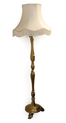 Lot 1533 - A Brass Standard Lamp and Shade, circa 1900, the acanthus scrolled fitment on a baluster turned...