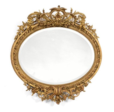 Lot 1542 - A Victorian Carved Giltwood and Gesso Oval Mirror, mid 19th century, the bevelled glass plate...