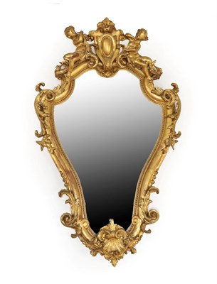 Lot 1543 - A 19th Century Italian Gilt and Gesso Mirror, of cartouche shaped form, the original mirror...