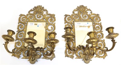 Lot 1548 - A Pair of Victorian Gilt Metal Three-Branch Girandole Mirrors, 3rd quarter 19th century, the...