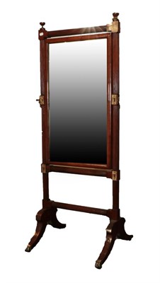 Lot 1549 - A Regency Mahogany Cheval Mirror, early 19th century, the bevelled glass plate between reeded...