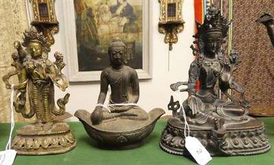 Lot 2 - A South East Asian Bronze Figure of  Buddha, 18th century, seated cross-legged on a double...