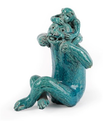 Lot 4 - A Chinese Turquoise Glazed Figure of a Monkey, 19th/20th century, naturalistically modelled seated