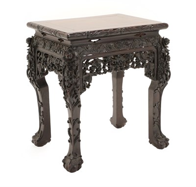 Lot 5 - A Chinese Hongmu Stand, Qing Dynasty, 19th century, the rectangular top over a carved and...