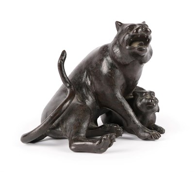 Lot 19 - A Japanese Bronze Figure of a Wild Cat, Meiji period, seated, a forepaw on her cub, three character