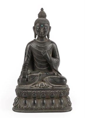 Lot 28 - A Chinese Bronze Figure of Buddha, 18th/19th century, seated cross-legged with turquoise...