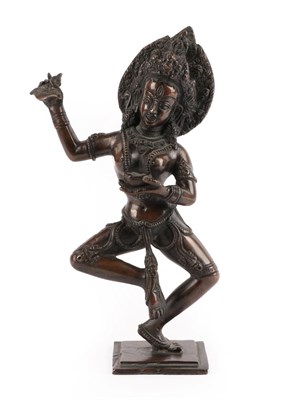Lot 41 - A Bronze Figure of a Dancing Dakini, Nepal, 19th century, standing on her left leg holding a...
