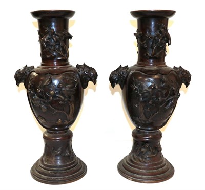 Lot 43 - A Pair of Japanese Bronze Vases, Meiji period, of baluster form with trumpet necks and mask...