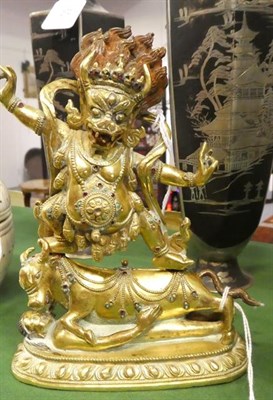 Lot 45 - A Gilt Bronze Figure of a Wrathful Deity, 18th/19th century, with hands raised and snarling...