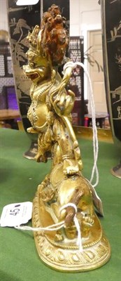 Lot 45 - A Gilt Bronze Figure of a Wrathful Deity, 18th/19th century, with hands raised and snarling...