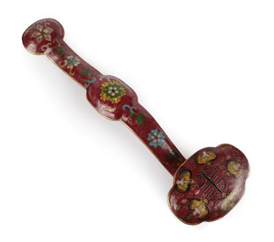 Lot 47 - A Chinese Cloisonné Ruyi Sceptre, Qing Dynasty, worked with scrolling foliage on a claret...