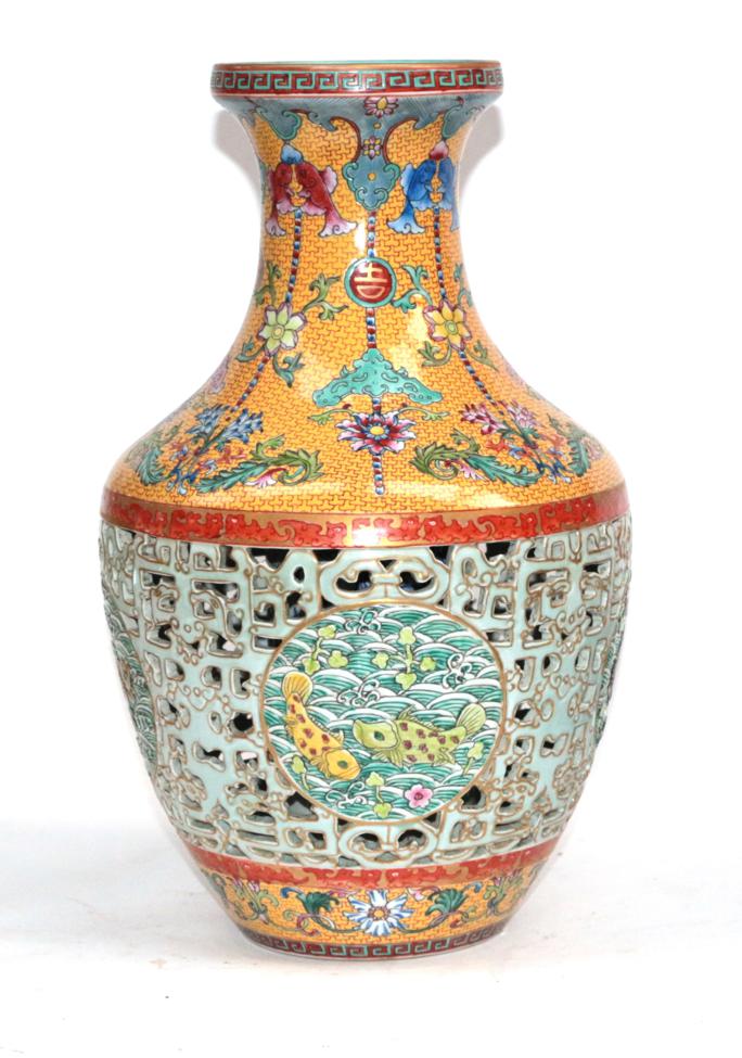 Lot 51 - A Chinese Porcelain Reticulated Vase, Qianlong seal mark but not of the period, of baluster...
