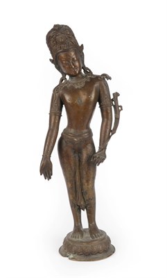 Lot 56 - A Copper Alloy Figure of Padmapani or Indra, Tibet or Nepal, 18th/19th century, standing...