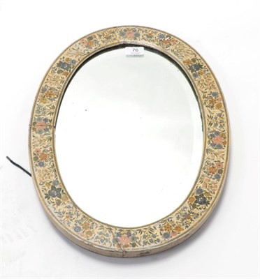 Lot 76 - An Indian Painted Wall Mirror, late 19th/early 20th century, of oval form with foliate...