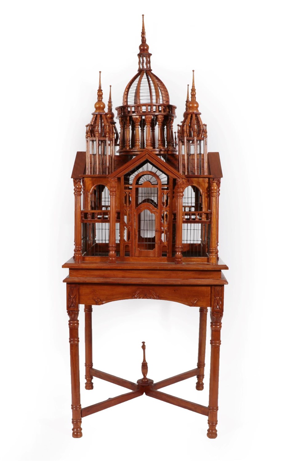 Lot 78 - A Hardwood Bird Cage, probably Indian, mid 20th century, with central dome flanked by four minarets