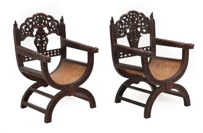 Lot 81 - A Pair of South-East Asian X Framed Hardwood Armchairs, probably Burmese or Thai, late...