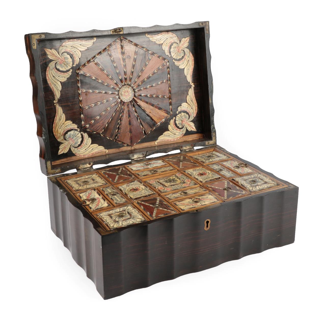 Lot 94 - A Ceylonese Coromandel, Ivory and Parquetry Work Box, 19th century, of shaped rectangular form, the