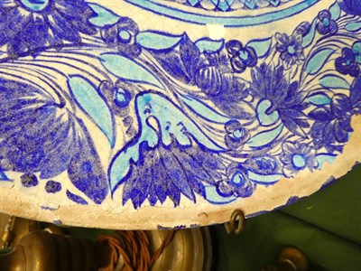 Lot 121 - A Multan Faience Dish, Sindh, 19th century, painted in blue and turquoise with central seated...