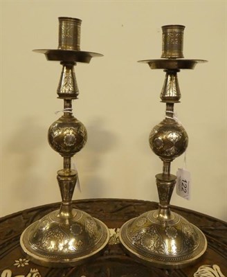 Lot 122 - A Pair of Koftgari Yellow and White Metal Inlaid Steel Candlesticks, 19th century, with cylindrical