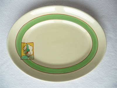 Lot 1454 - A Clarice Cliff Bizarre Oval Meat Plate, painted with an orange roofed house in a cartouche,...