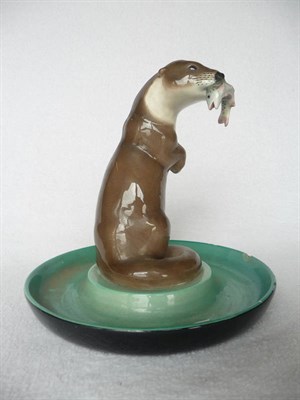 Lot 1455 - A Lenci Earthenware Circular Centre Dish, modelled with an otter holding a salmon in his mouth,...