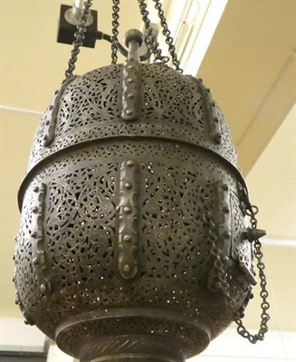 Lot 177 - A Steel Mosque Lamp, 19th century, of ovoid form with minaret finials, cast and pierced with...