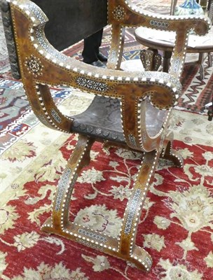 Lot 189 - A Bone Inlaid and Parquetry Savonarola Armchair, late 19th century, with leather back over...