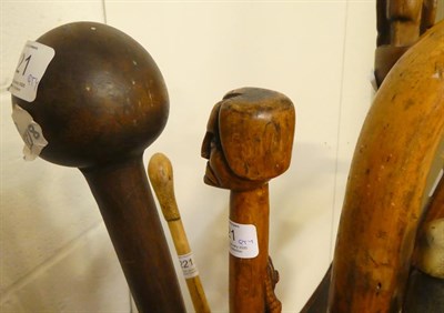 Lot 221 - A Shona Axe, with brass stud decoration; A Zulu Chief's Staff; An African Haft for an Axe; and Nine