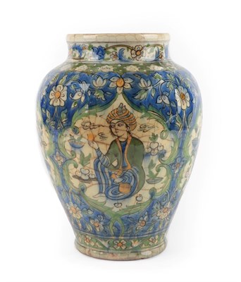 Lot 228 - A Qajar Faience Vase, late 19th century, of baluster form, painted with figures in leaf scroll...